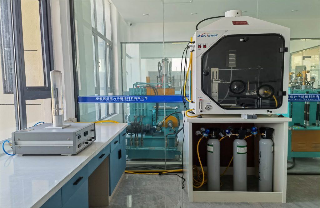 In house fire testing laboratory with a smoke density test chamber and gas supply cylinders CAPTION: Figure 1. In house fire testing equipment used for development and incoming verification.