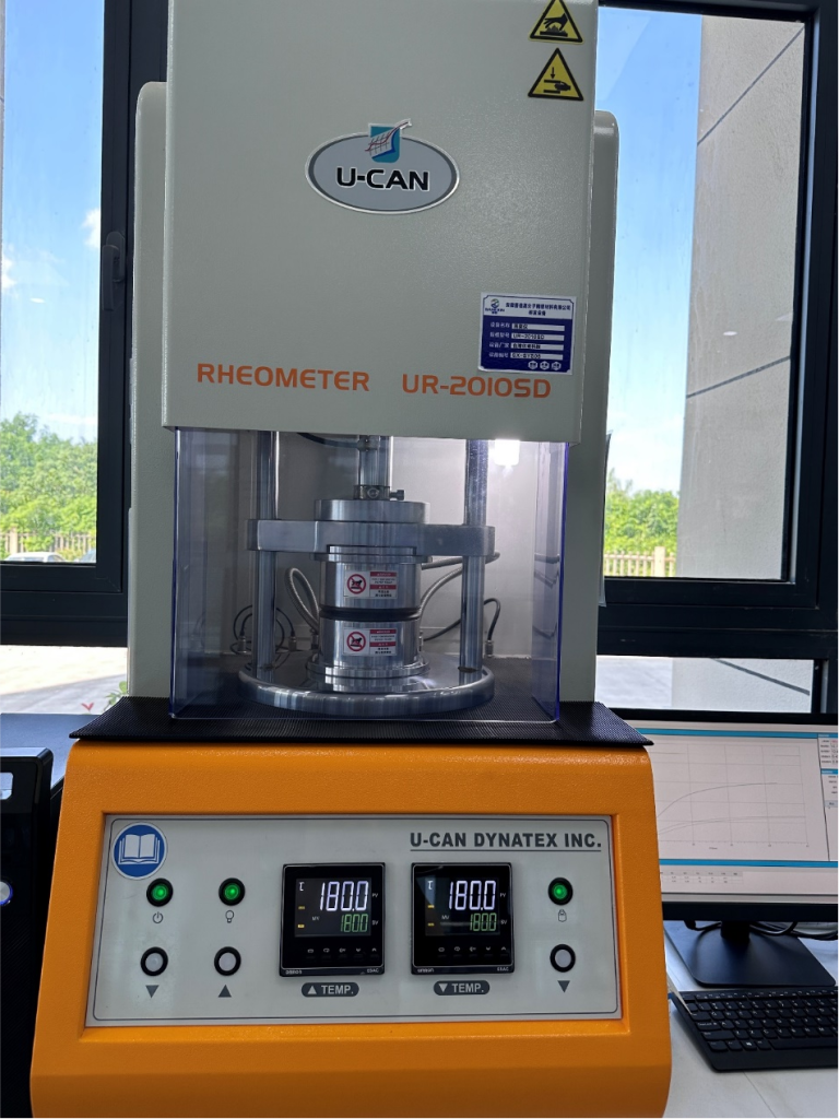 Technician is performing a tensile test and hardness measurement on a sample in a quality control laboratory