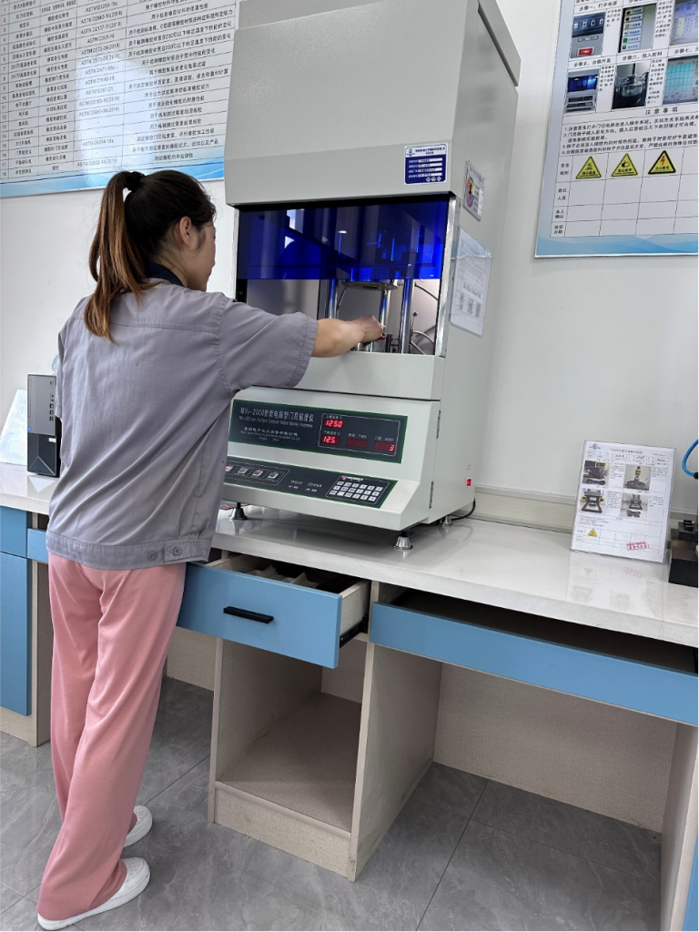 Technician is performing a tensile test and hardness measurement on a sample in a quality control laboratory png